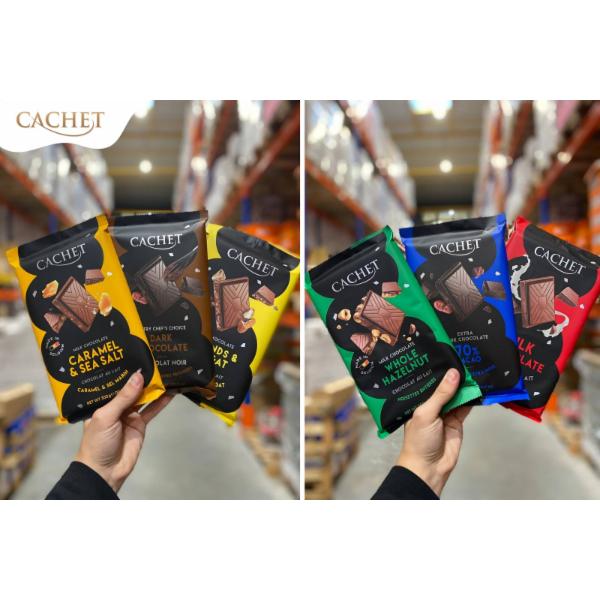 Cachet Caramel & Sea Salt (32% cacao) 21704 300 g, Cachet Almonds and Raisins (32% cacao) 21722 300 g, Cachet Extra Dark (70% cacao) 21706 300 g, Cachet Almonds (32% cacao) 21721 300 g, Cachet Dark (54% cacao) 21705 300 g, Cachet Milk (32% cacao) 21701 300 g, Cachet Hazelnut (54% cacao) 21724 300 g, Cachet Almonds (54% cacao) 21723 300 g, Cachet Hazelnut (32% cacao) 21702 300 g, Cachet Creamy Milk 21427 100 g, Cachet Extra Dark (70% cacao) 100 g, Cachet 70% 21371 Cacao Extra Dark 100 g, Cachet Caramel & Sea Salt 21431 100 g, Cachet 57% 21374 Peppermint Flavour none, Cachet Almonds & Orange 21421 100 g, Cachet Almonds & Pear (57% cacao) 21422 100 g, Cachet 57% 21456 Lemon & Peper 100 g, Cachet Ginger & Blackberry Flavour (57% cacao) 21423 100 g, Cachet Peru (64% cacao) 21404 100 g, Cachet Uganda (80% cacao) 21406 100 g, Cachet Extremely Dark (90% cacao) 21425 100 g, Cachet Coconut White 21813 100 g, Cachet Extra Dark (85% cacao) 21426 100 g, Cachet Extra Dark Sea Salt (70% cacao) 21429 100 g, Cachet Costa Rica (71% cacao) 21405 100 g, Cachet Brownie & Pretzel (31% cacao) 22132 180 g, Cachet Caramel & Sea Salt, 22133 180 g, Cachet Hazelnut (31% cacao) 21432 100 g, Cachet Salty Roasted Corn (31% cacao) 21430 100 g, Cachet Cherry (57% cacao) 21424 100 g, Cachet Almonds & Honey 100 g, Cachet Coconut & Pineapple (57% cacao) 100 g, Cachet Almonds & Sea Salt (57% cacao) 100 g, Cachet Extra Dark (70% cacao) 21428 100 g, Cachet Almonds & Nougat (32% cacao)) 21703 300 g, Cachet Tanzania (72% cacao) 21407 100 g, Cachet Minis MIX (Milk & dark chocolates) 12131 185 g, Cachet Minis Red (Extra dark chocolate 70%) 12132 185 g, Cachet Minis Green (Milk chocolates with hazelnut) 12133 185 g, Cachet Minis Mix Gold (Milk & dark chocolate) 12134 1000 g, Cachet Pralines (Milk, Dark, White) 12129 250 g, Cachet Display (48 x 45-50g) 22150 (BOX) 50 g, Cachet Hazelnut 21702 300 g, Cachet In Love with Raspberry 21435 100 g, Cachet Christmas Edition (Red) 20492 100 g, Cachet Christmas Edition (White) 20493 100 g, Cachet Christmas Edition (Black) 20490 100 g, Cachet Cameroon (80% cacao) 21408 100 g, Cachet Cornflakes, 22144 180 g, Cachet Dark (54% cacao) 29010 500 g, Cachet Milk (32% cacao) 29011 500 g, Cachet Yoghurt Raspberry 45 g, Cachet Coffee Cream 45 g, Cachet Caramel&Sea Salt 45 g, Cachet Coconut&Cookie 45 g, Cachet Hazelnut Pieces 45 g, Cachet Hazelnut Cream 45 g
